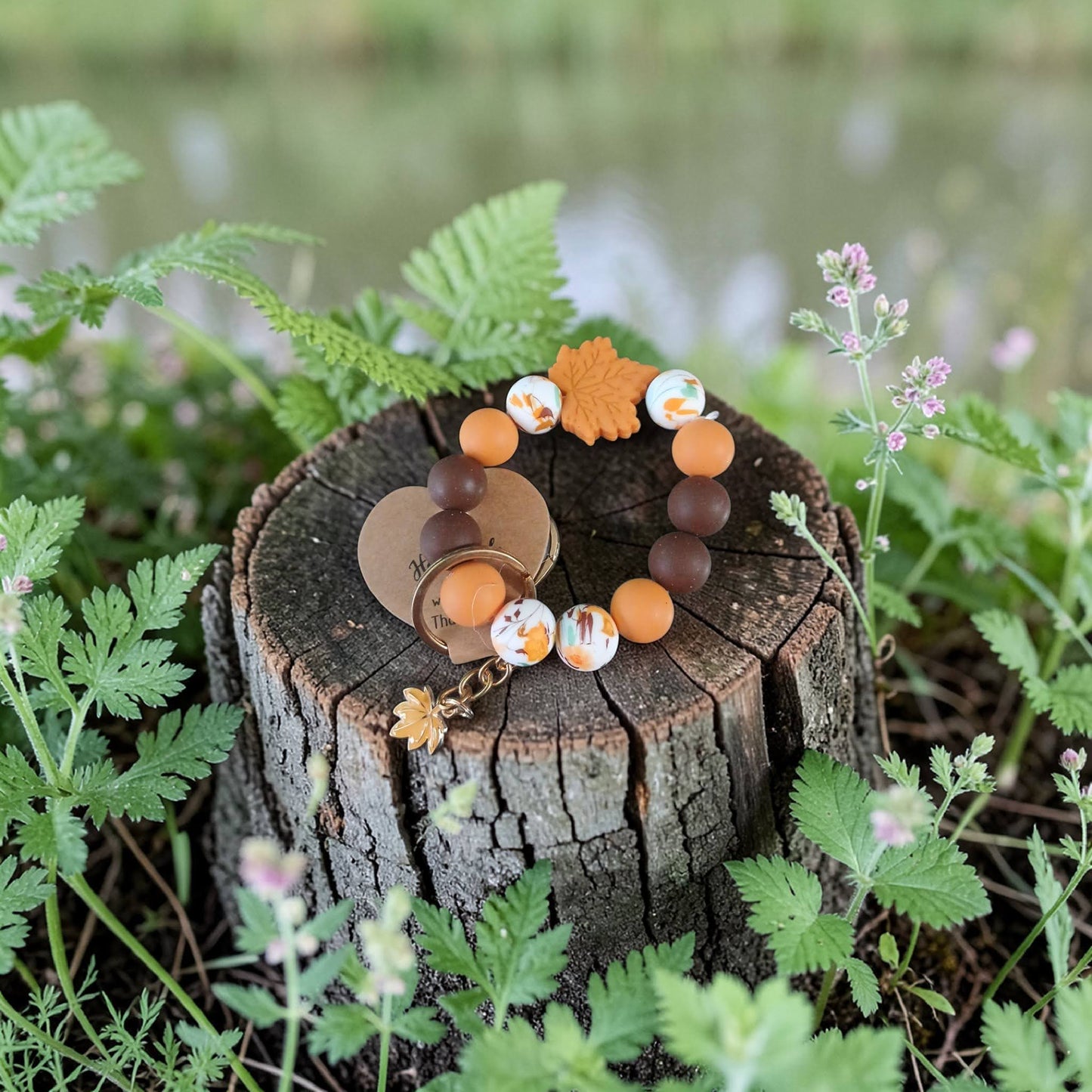 Set of bracelets on a wooden stump with a natural background