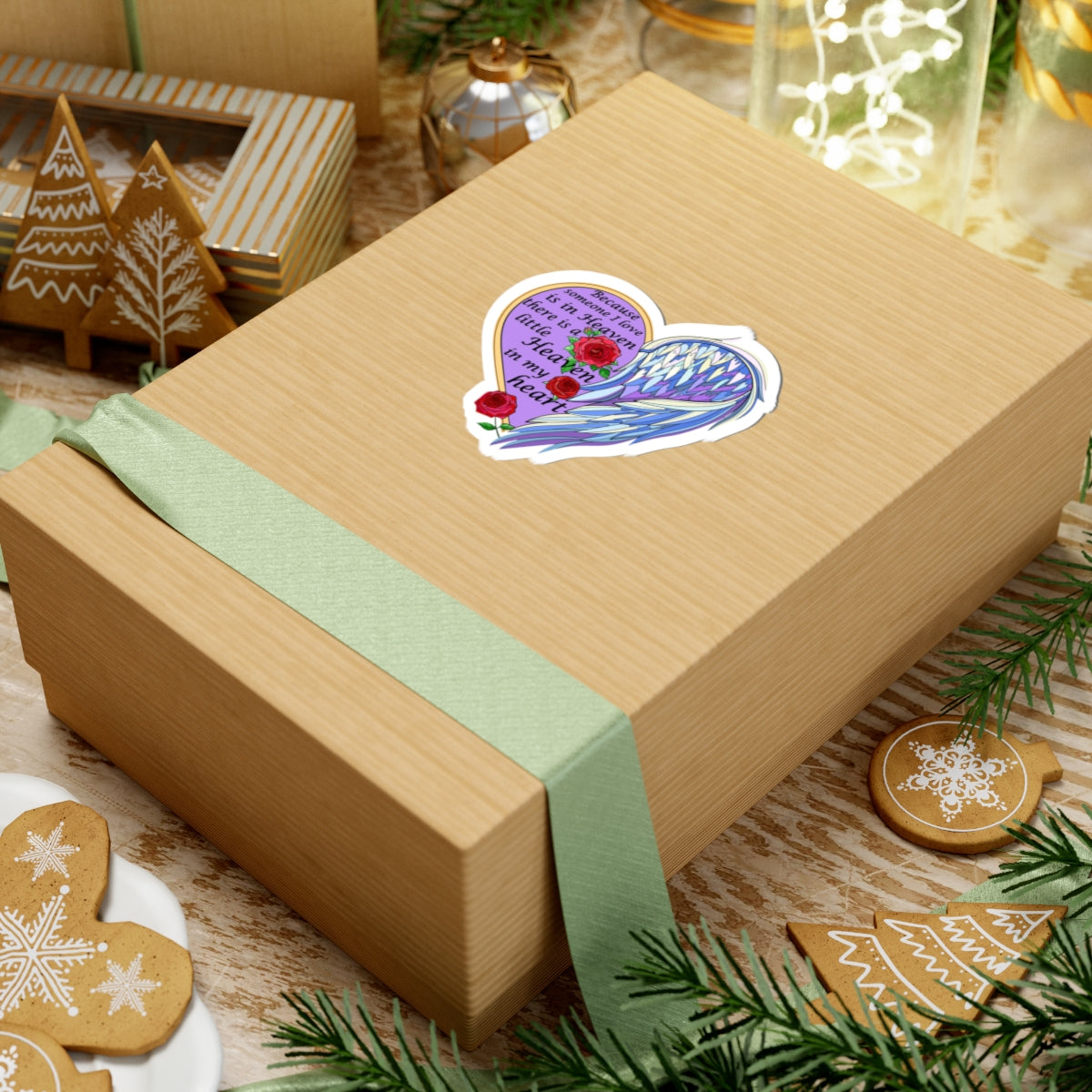 Wooden gift box with a decorative sticker on a festive background with cookies and greenery.