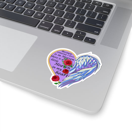 Decorative sticker with angel wings and roses on a laptop