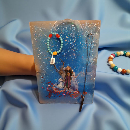 Frozen-themed bracelet with character design on a blue fabric background