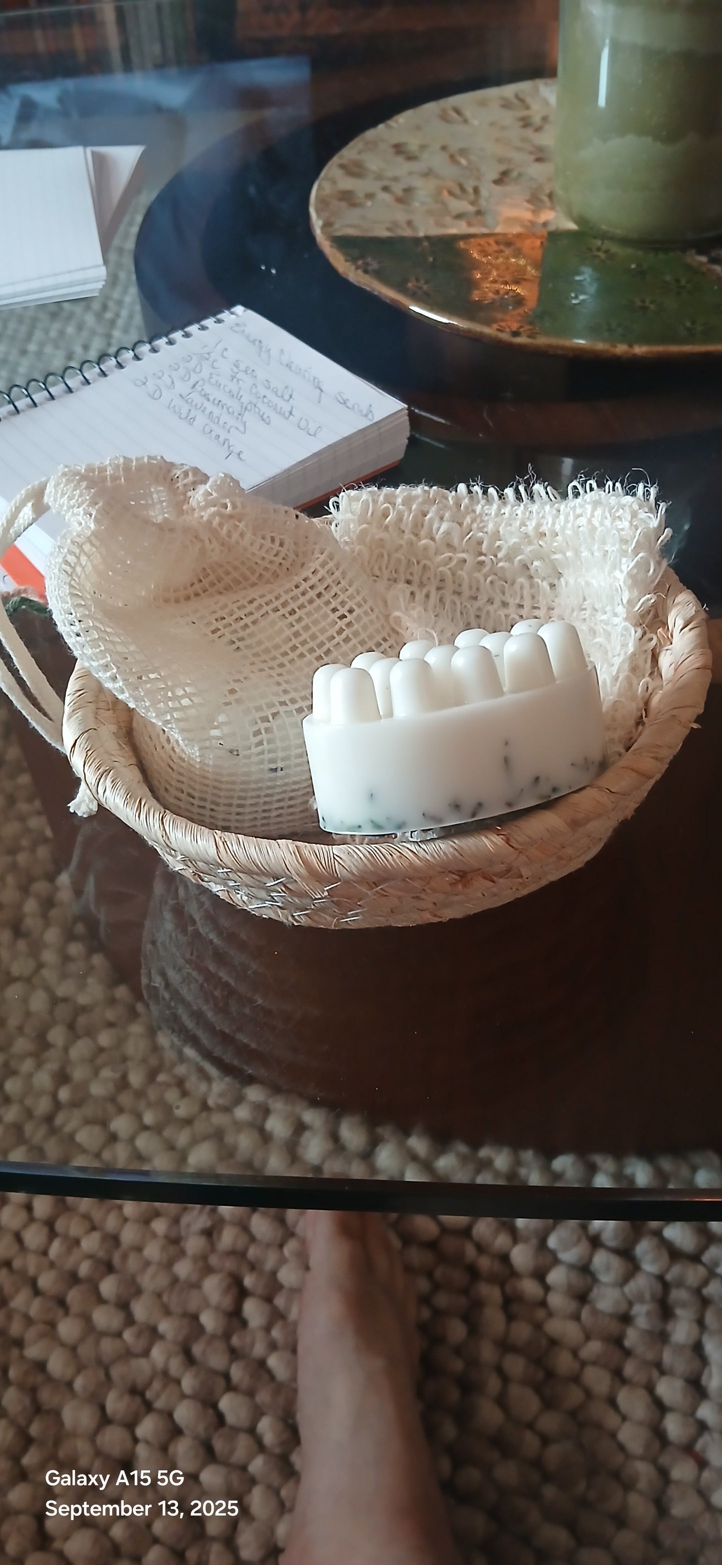 Beige scrubber with bristles on a dark surface