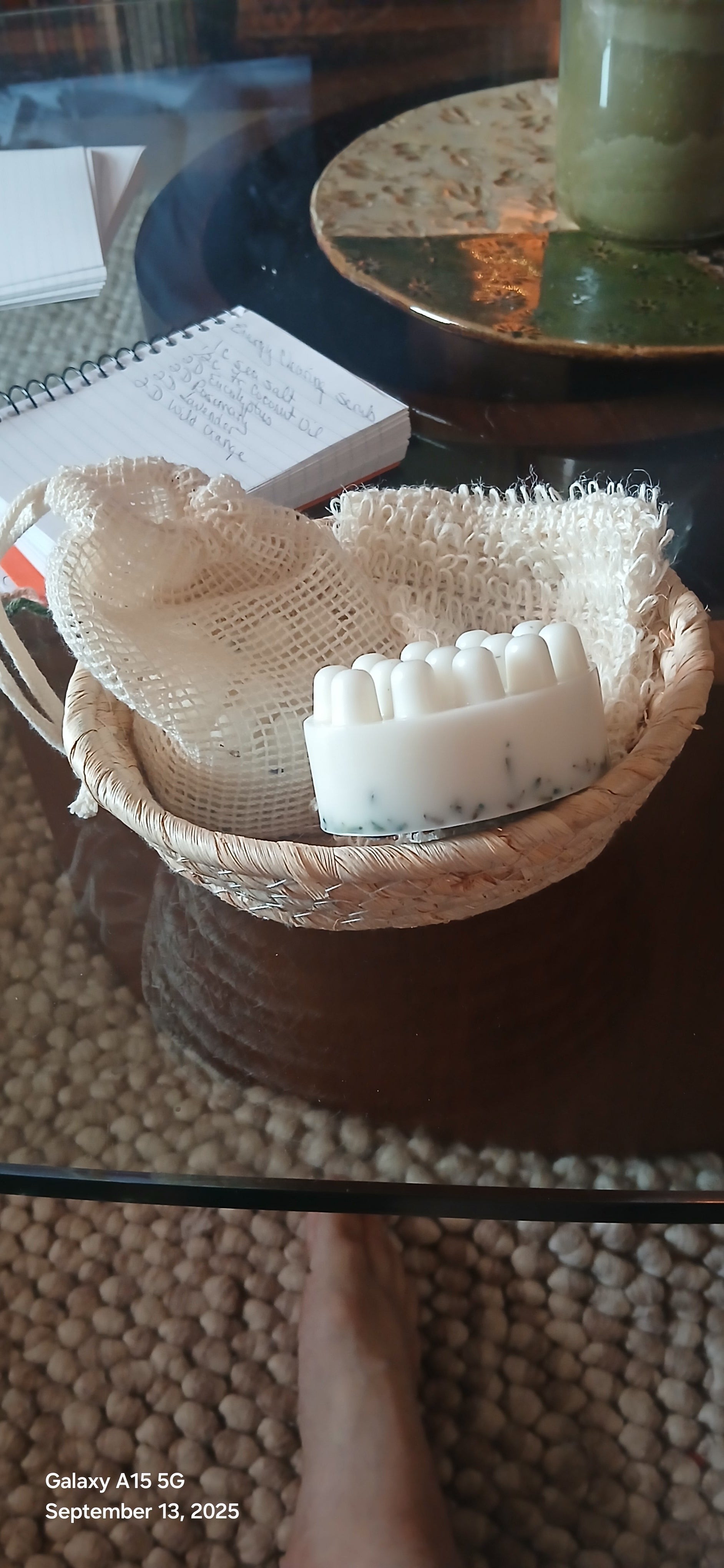 Beige scrubber with bristles on a dark surface
