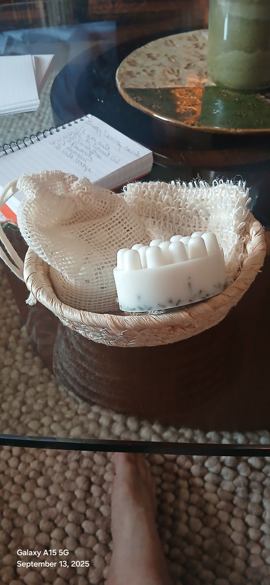 Beige scrubber with bristles on a dark surface